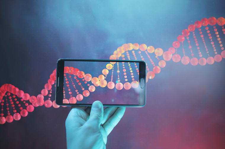 Image: DNA double helix strand viewed with a phone