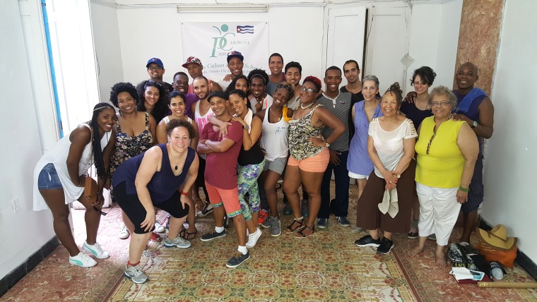 A group of college students and professors from the University of Baltimore pose with their dance instructors after a salsa lesson at Pasion Caribeña. The group was in Cuba for a three-week educational exchange.