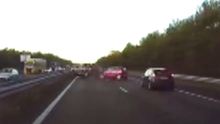 This screengrab from a dash cam video posted online on Dec. 27, 2016 shows the moment when a car in front of a Tesla Model X crashed into another vehicle in Belgium. The driver credits the Tesla's "autopilot" function with beginning to brake before he even knew anything was wrong.