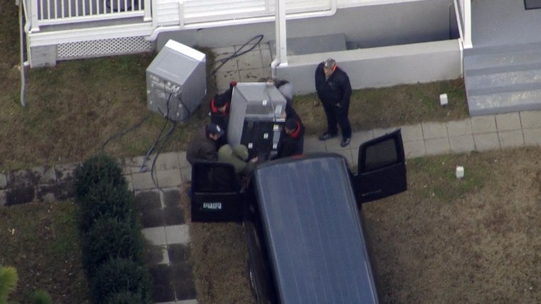 Image: Equipment is removed from the Russian compound at Pioneer Point in Maryland.