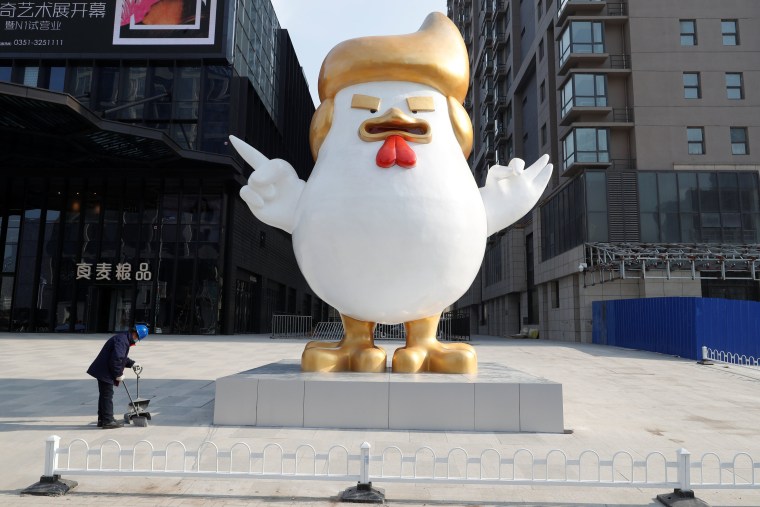 Image: A sculpture of a rooster that local media say bears resemblance to U.S. President-elect Donald Trump is seen outside a shopping mall in Taiyuan