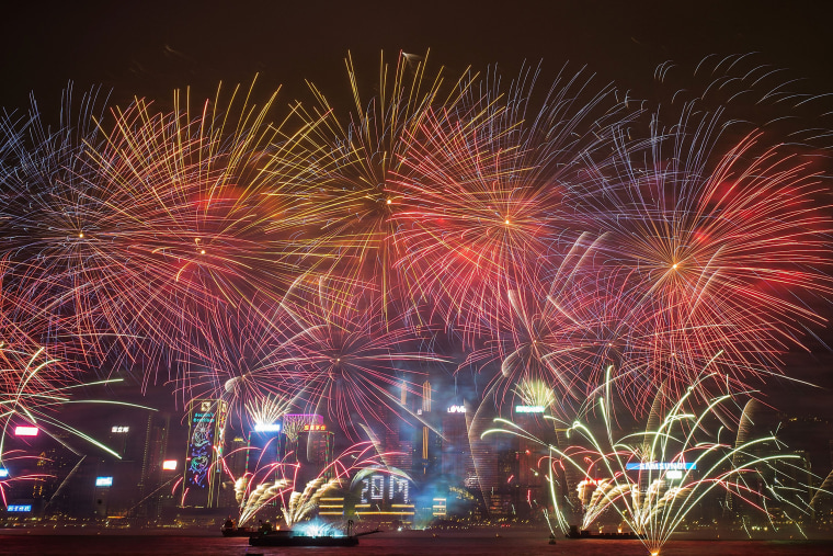 Image: Fireworks illuminate the city's skyline during New Year countdown celebrations