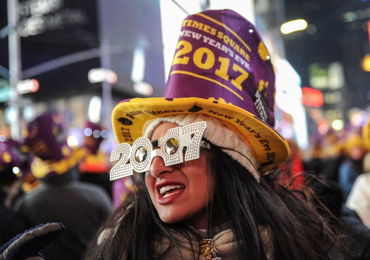 Image: Revelers gather in Times Square on New Year's Eve in New York