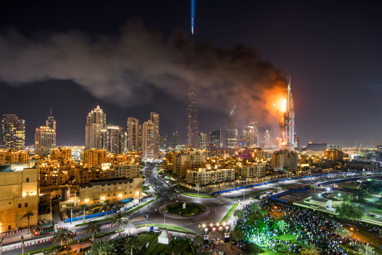 Image: Flames and smoke after a fire broke out at the The Address Hotel in Dubai