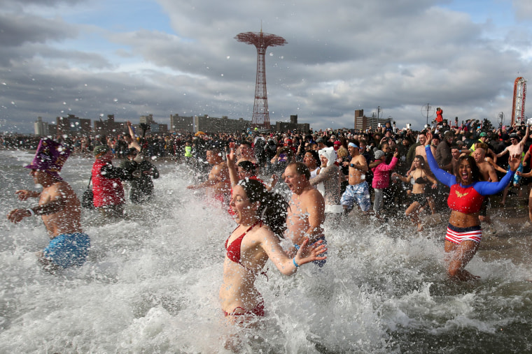 Image: Participants enter the water during the Coney Island Polar Bear Club's annual New Year's Day swim at Coney Island in the Brooklyn borough of New York.