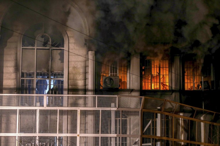 Image: Flames and smoke rise from Saudi Arabia's embassy during a demonstration at in Tehran