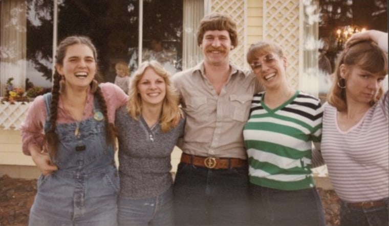 An old family photo showing Larry and his four sisters.