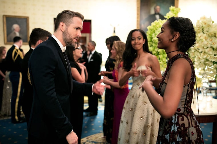 Image: Sasha and Malia talk with actor Ryan Reynolds