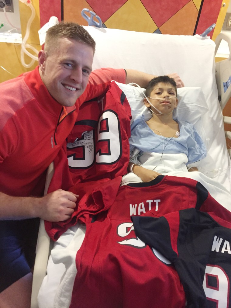 Houston Texans football player J.J. Watt surprising young fan, Noah Fulmer, 8, after he was in a car accident.