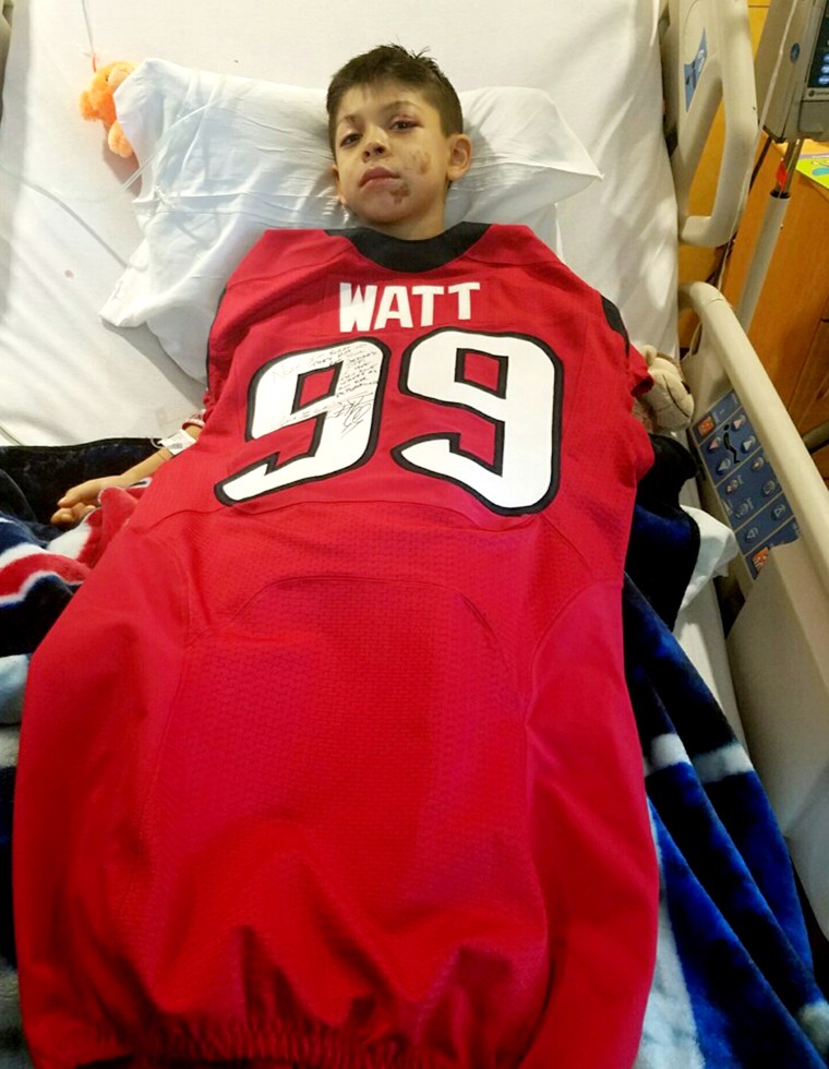 Houston Texans football player J.J. Watt surprising young fan, Noah Fulmer, 8, after he was in a car accident.