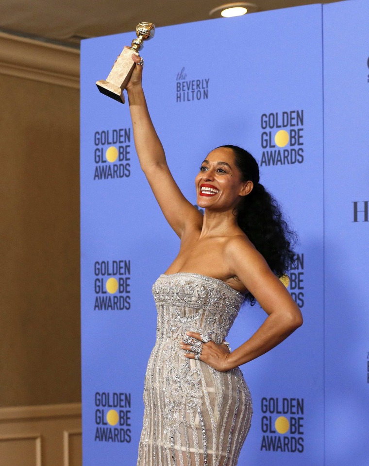 Image: Tracee Ellis Ross holds her award during the 74th Annual Golden Globe Awards in Beverly Hills