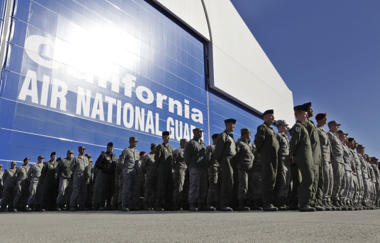 California Army National Guard soldiers watch the arrival of the body of soldier Sean Walsh, who died on Nov. 16 during a combat operation in Afghanistan, at Moffett Federal Airfield in Mountain View, California in 2011.