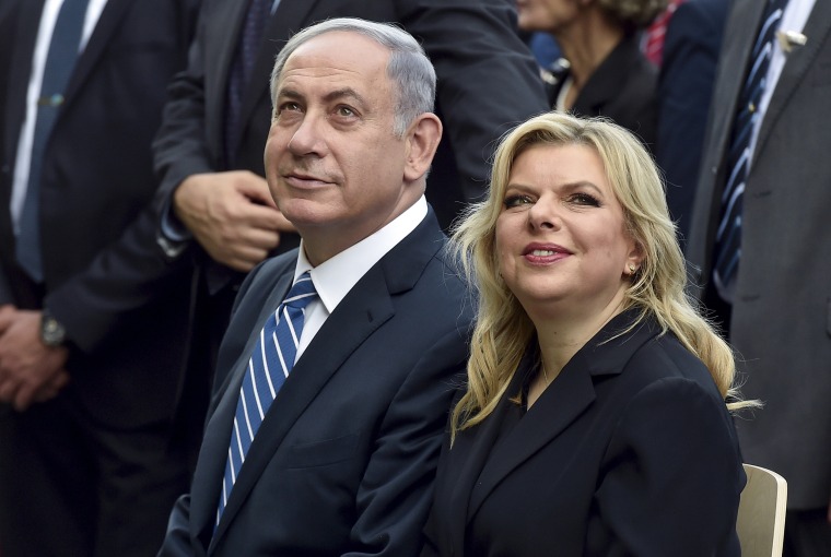 Image: Israel's Prime Minister Netanyahu sits next to his wife Sara in 2015