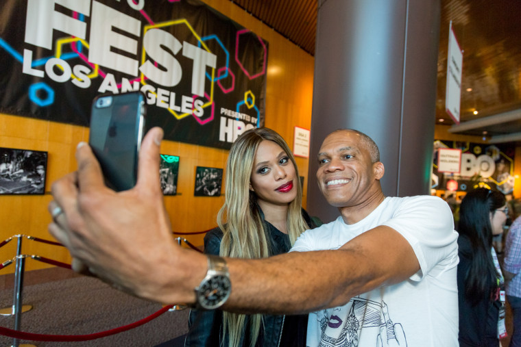 Image: Actress Laverne Cox (L) takes a photo with a guest