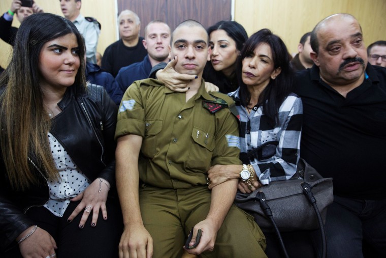 Image: Israeli soldier Elor Azaria, who is charged with manslaughter by the Israeli military, sits to hear his verdict in a military court in Tel Aviv, Israel