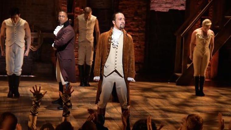Actor Leslie Odom, Jr. (L) and actor, composer Lin-Manuel Miranda (R) and cast of 'Hamilton' perform on stage during 'Hamilton.' Theo Wargo | WireImage | Getty Images