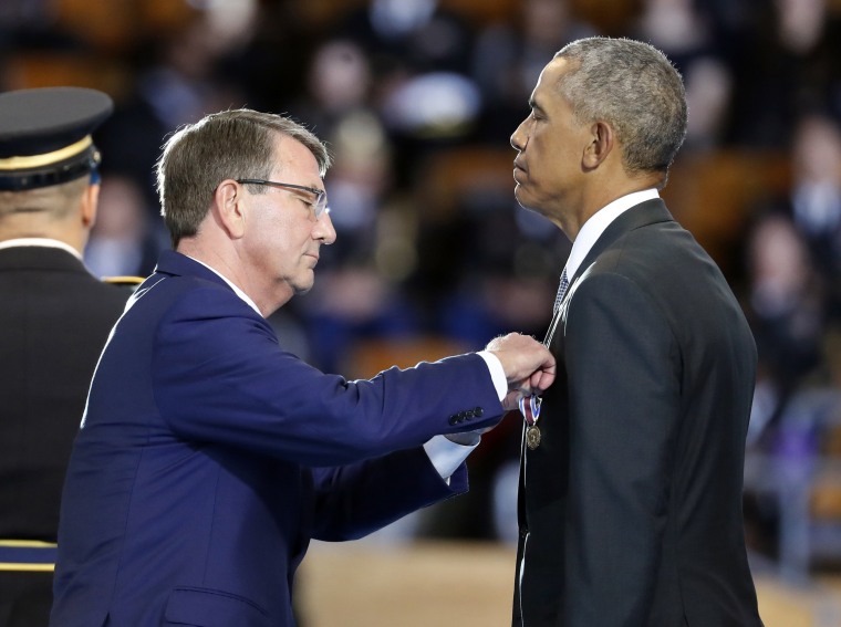 Image: Defense Secretary Ash Carter pins the Department of Defense for Distinguished Public Service on President Barack Obama during an Armed Forces Full Honor Farewell Review for the president on Jan. 4, 2017, at Conmy Hall, Joint Base Myer-Henderson Hal