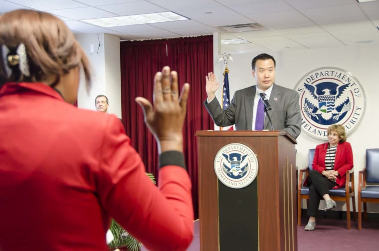 Shin Inouye swearing in new citizens at a naturalization ceremony.