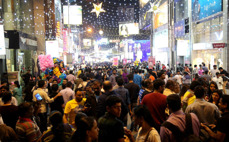 Image: Hundreds of people gather to attend the eve of new year celebration in Bangalore