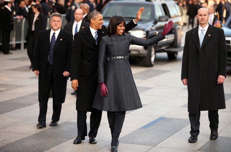 Image: President Barack Obama and First lady Michelle Obama walk the route as the presidential inaugural parade winds through the nation's capital on Jan. 21, 2013 in Washington, D.C.