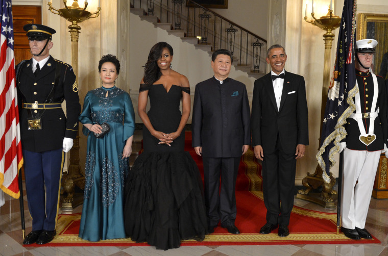 Image: President Barack Obama and first lady Michelle Obama pose with Chinese President Xi Jinping and Madame Peng Liyuan as they arrive for a State Dinner at the White House, in Washington, D.C, on Sept.25, 2015.