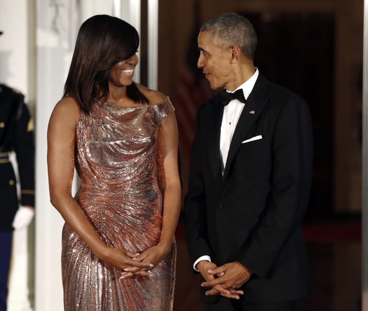 Image: President Barack Obama and first lady Michelle Obama wait to greet Italian Prime Minister Matteo Renzi and his wife Agnese Landini on the North Portico for a State Dinner at the White House in Washington, D.C., Oct. 18, 2016.