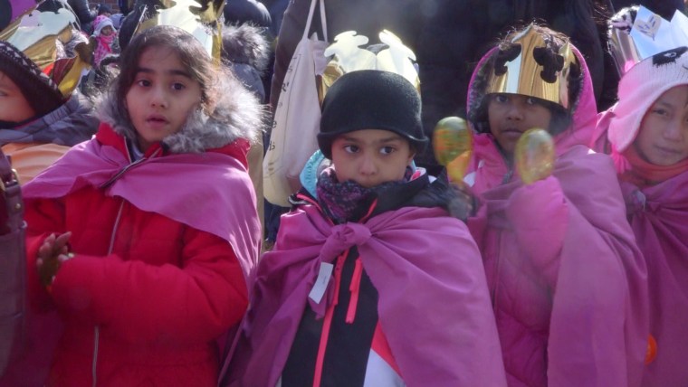 Children from P.S. 103 in the Bronx, New York City, walk in the 40th annual Three Kings Day Parade organized by El Museo del Barrio.