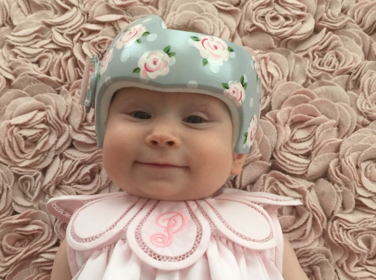 Regan Luke lives in the south, where "a proper baby girl rocks a matching bow with every outfit." So when her daughter, Piper, needed a corrective helmet, the Texas mom tasked Strawn with creating a masterpiece fit for a girly  girl.