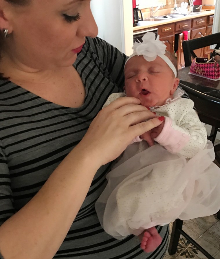 Mom who wore Chewbacca mask during labor holds her new daughter