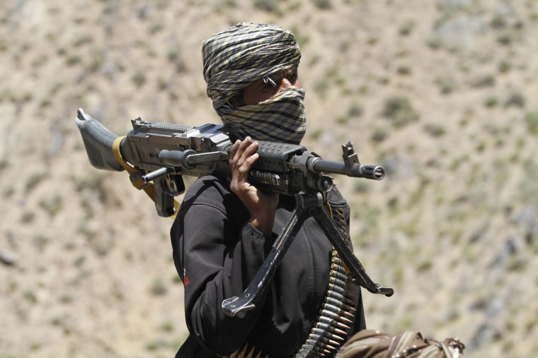 Image: Image: A member of a Taliban faction