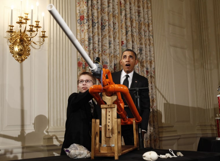 Image: U.S. President Obama reacts as Hudy launches a marshmallow from his Extreme Marshmallow Cannon during the second White House Science Fair in Washington