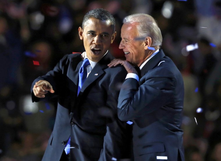 Image: U.S. President Barack Obama gestures with Vice President Joe Biden after his election night victory speech in Chicago