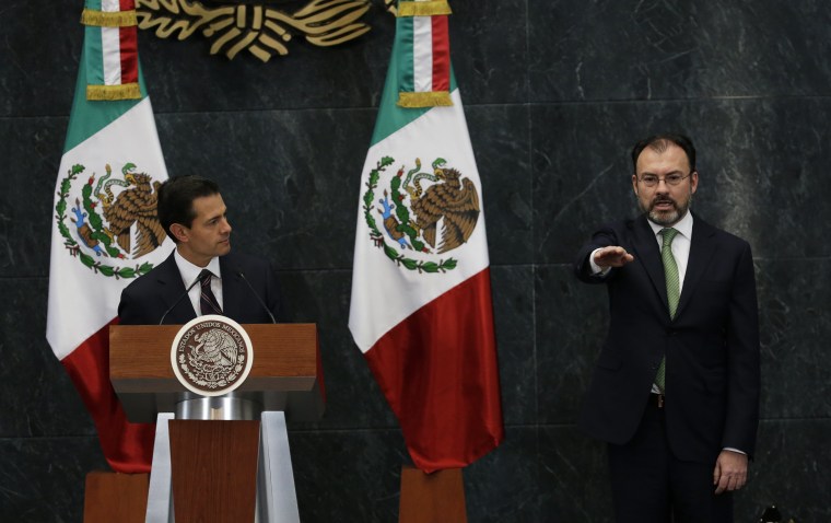 Image: Mexico's President Enrique Pena Nieto, right, listens as Luis Videgaray