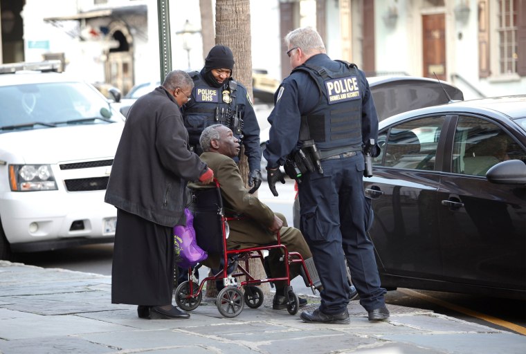 Image: John Pinckney, father of Emanuel Church shooting victim Rev. Clementa Pinckney, is helped by Homeland Security officers as he arrives at the Charleston Federal Courthouse during the federal trial of Dylann Roof in Charleston