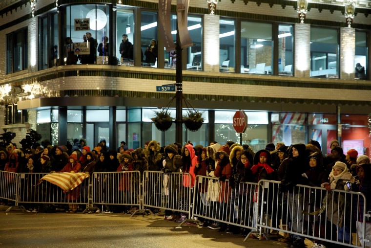 Image: People line a street while trying to catch a glimpse of President Obama, who was making a stop nearby on his way to deliver his farewell address in Chicago, Illinois on Jan. 10.