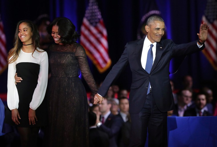 Image: First Lady Michelle Obama and President Barack Obama greet supporters as daughter Malia looks on after the President delivered his farewell address in Chicago, Illinois on Jan. 10.
