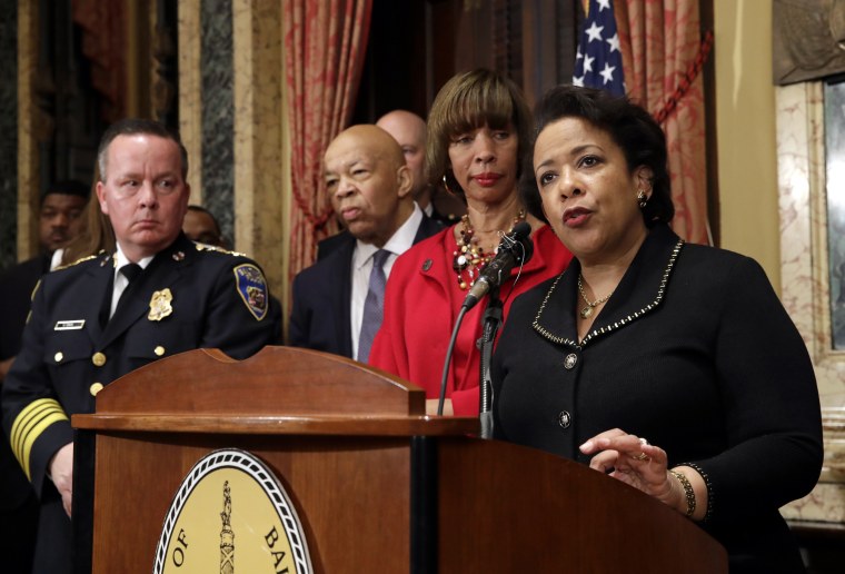 Image: Attorney General Loretta Lynch, right, speaks during a joint news conference in Baltimore on Jan. 12. to announce the Baltimore Police Department's commitment to a sweeping overhaul of its practices under a court-enforceable agreement with the fede