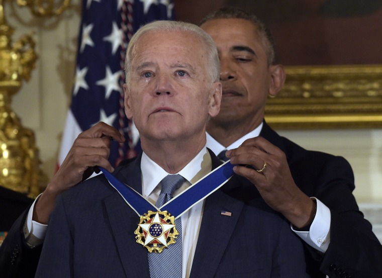Image: President Barack Obama presents Vice President Joe Biden with the Presidential Medal of Freedom during a ceremony in the State Dining Room of the White House in Washington, Jan. 12.