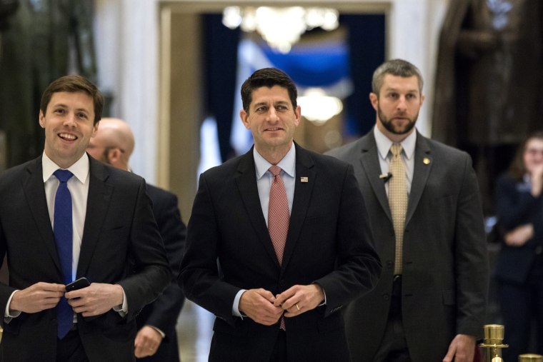 Image:  Ryan walks to the House floor where representatives were voting on a budget resolution