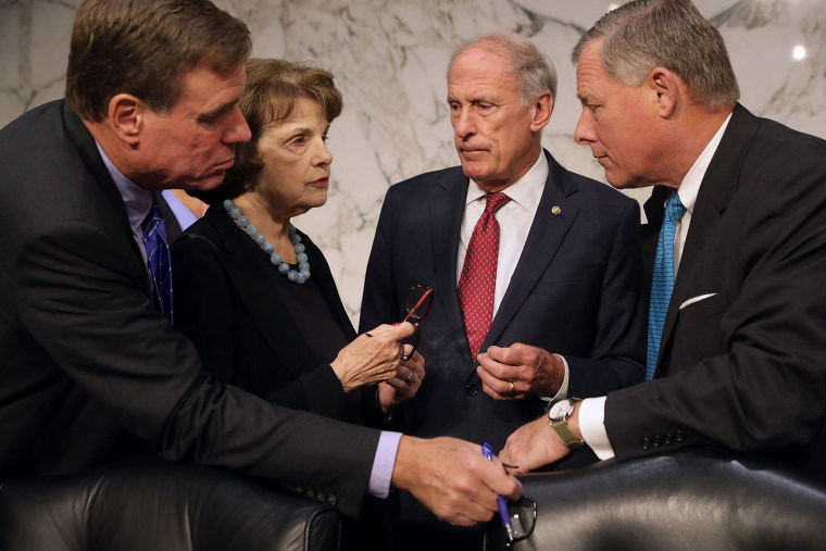 Image: Senate Committee on Intelligence members Sen. Mark Warner, Sen. Dianne Feinstein, Sen. Dan Coats, and Chairman Richard Burr confer before hearing a testimony on Capitol Hill on Sept. 27, 2016 in Washington, D.C.