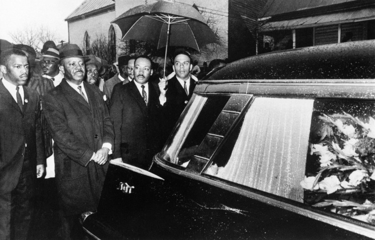 Image: Dr. Martin Luther King, Jr. and associates lead a procession following the casket of Jimmy Lee Jackson during a funeral service in Marion, Alabama, March 1, 1965.