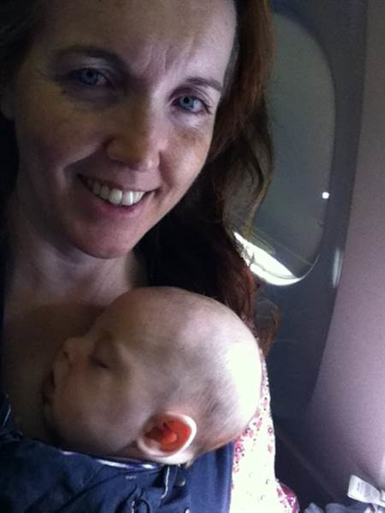 Rebecca Dube and her baby Joseph on a flight