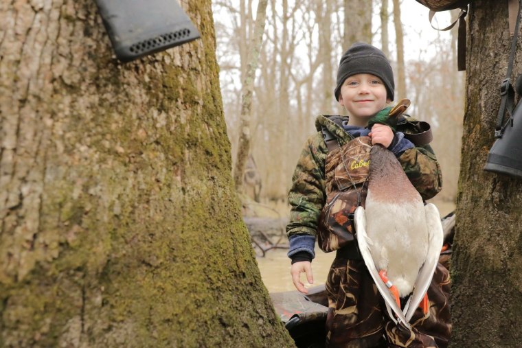 Tripp Halford, 5, with a duck on his first hunting trip.