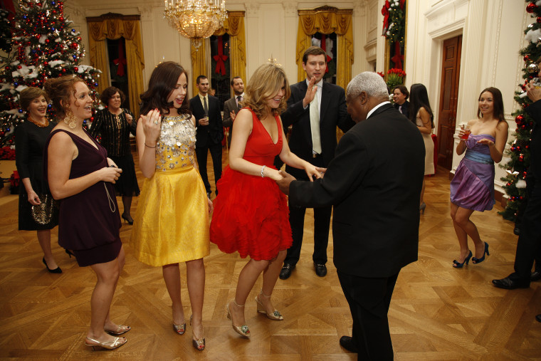 The Bush sisters dance with staff during a family holiday party at the White House.