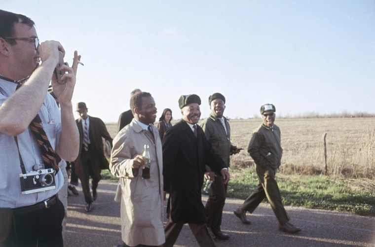 Image: John Lewis, Dr. Martin Luther King Jr. and Ralph Abernathy, march for civil rights from Selma to Montgomery, Alabama on March 19, 1965