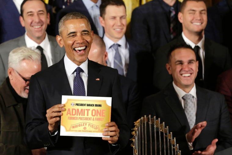Image: Obama holds a lifetime admission certificate