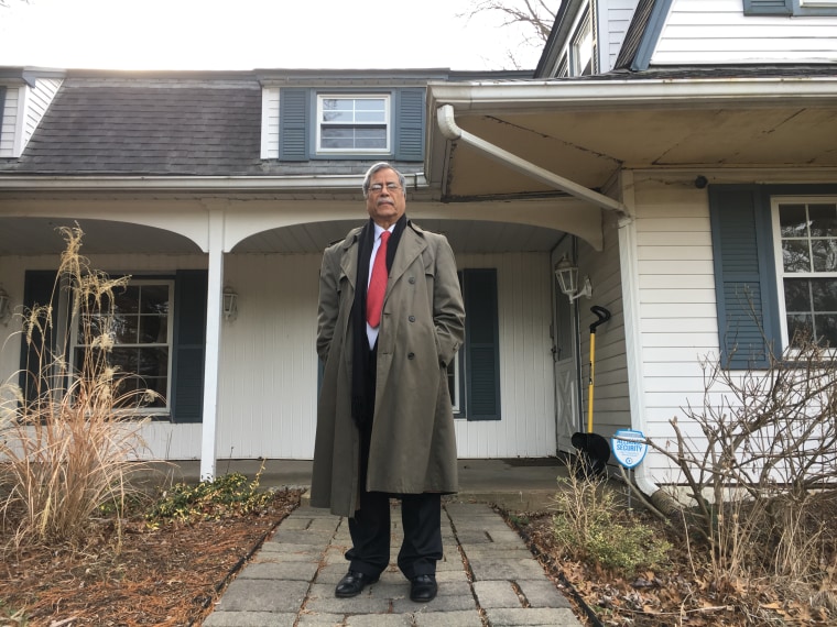 Mohammad Ali Chaudry, president of the Islamic Society of Basking Ridge, at the entrance of the house he wants to raze to build a mosque.