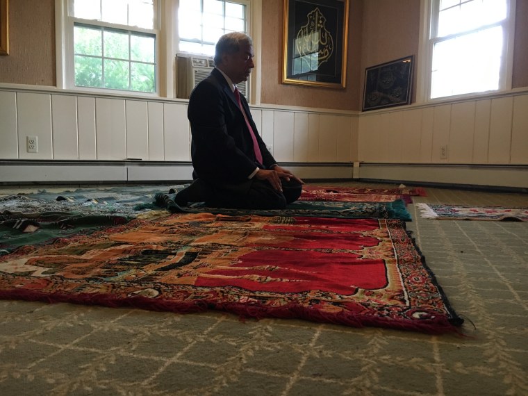 Mohammad Ali Chaudry, president of the Islamic Society of Basking Ridge, prays in the two-story home he is suing to turn into a mosque.