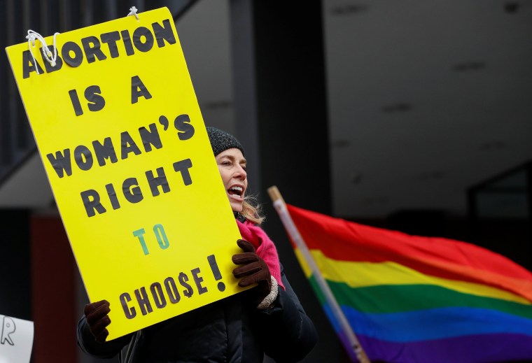 Image: Anti-Trump demonstrator protests at abortion rights rally in Chicago