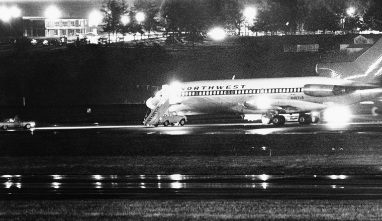 Image: A hijacked Northwest Airlines jetliner 727 sits on a runway for refueling at Tacoma International Airport, Nov. 25, 1971, Seattle, Wash.